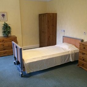 Bedroom at Hazelwood Gardens Nursing Home with a single bed
