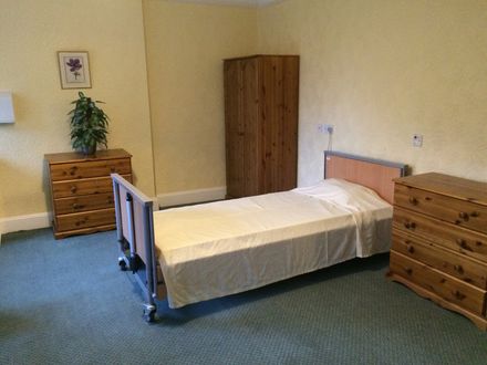 Bedroom at Hazelwood Gardens Nursing Home with a single bed